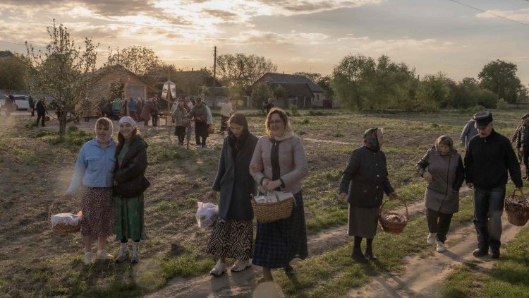 Orthodox believers carry traditional Easter baskets in the village of Krasne, Ukraine