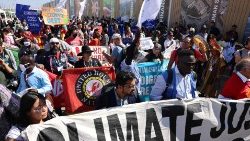 Climate activists hold a protest in Sharm el-Sheikh