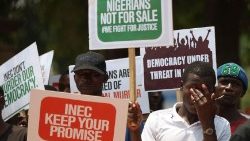 Protesters display placards to protest the outcome of the 2023 presidential election in Nigeria