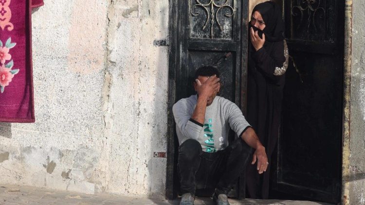 A Palestinian couple mourn the death of their twin babies in an Israeli strike on Rafah