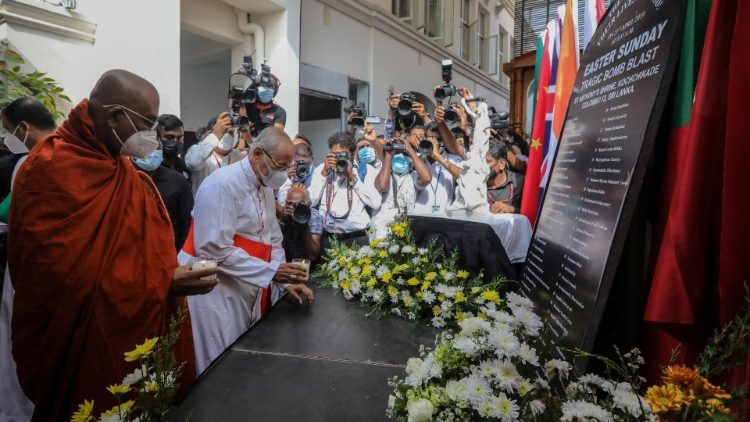Cardinal Ranjith lights a candle at a memorial for the victims of the Easter Sunday bombings
