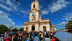 Parishioners at the church of San Jeronimo in Masaya, Nicaragua surrounded by riot police enforcing the ban on festivities