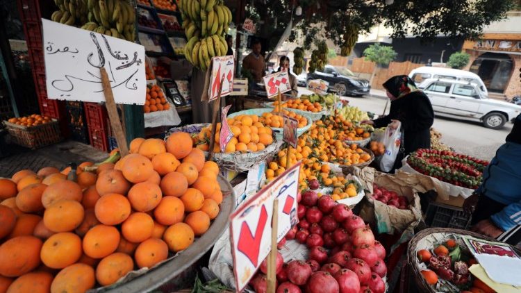 People buy fruit and vegetables in Cairo