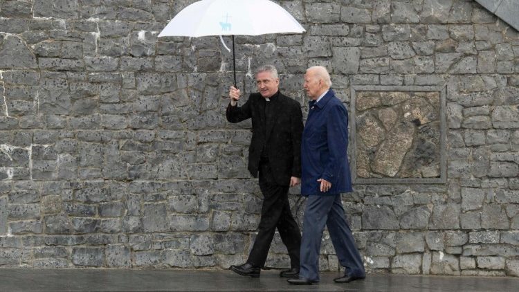 US President Joe Biden (R) walks with Father Richard Gibbons during a visit to the shrine in Knock, County Mayo, Ireland, on Friday