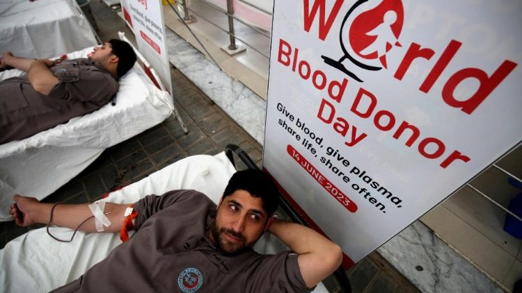 People donate blood on World Blood Donor Day in Peshawar