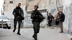 Israeli police officers patrol an area in East Jerusalem