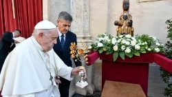 Pope Francis places a golden rose statue at the feet of Our Lady's image