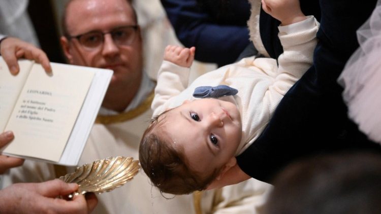 Pope Francis baptises children in the Sistine Chapel