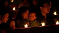 Chinesische katholische Gläubige im Gebet