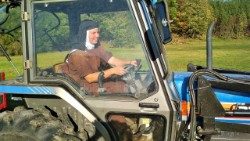 One of the Carmelite nuns in a tractor