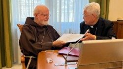 Cardinal O'Malley and Cardinal You sign the agreement