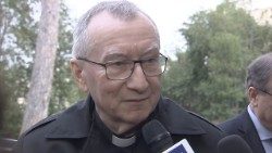 Cardinal Parolin speaks with reporters on the sidelines of a meeting at the Pontifical Urban University