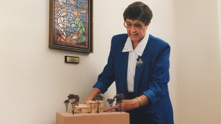 Sister Elaine with a model of proposed affordable housing