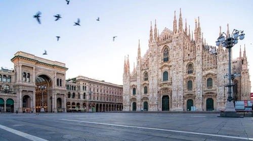 Galleeria Vittorio Emenuele and Milan Cathedral square with flying pegion in the ...
