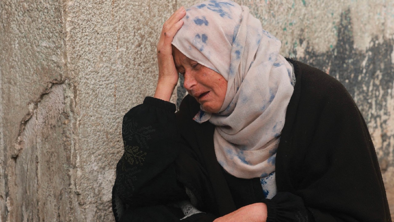A Palestinian woman mourns the death of a loved one at Al-Najjar hospital following overnight ...