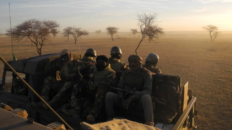 Malian soldiers patrol the border zone with Burkina Faso in the ongoing battle against jihadist insurgents