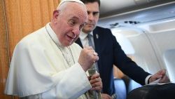 Pope Francis answers questions by journalists during the flight from Skopje to Rome