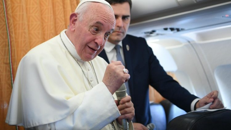 Pope Francis answers questions by journalists during the flight from Skopje to Rome