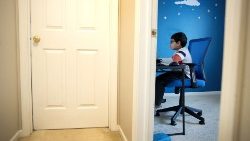 Child participates in remote learning in the United States during Coronavirus lockdown