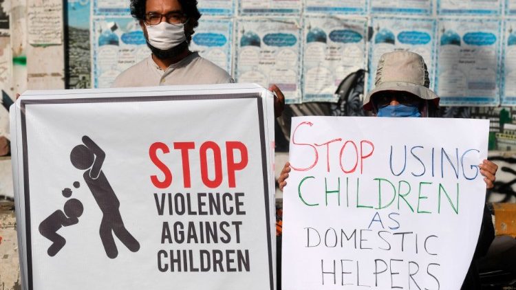 Activists carry placards during a protest in Pakistan