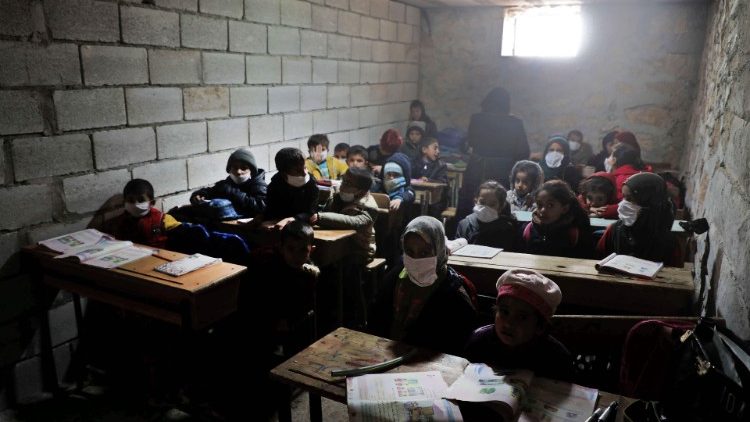 Syrian school children in a makeshift school set up by locals in the village of Ma'arin