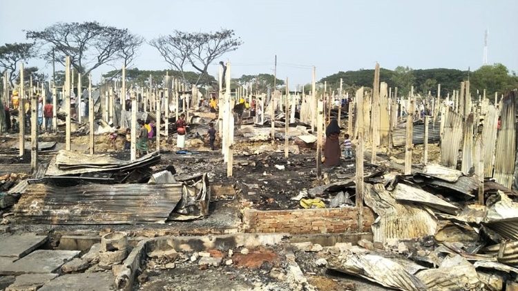Charred remains of shelters after a fire  at the Rohingya refugee camp at Nayapara, Bangladesh, on 14 Jan. 2021.  
