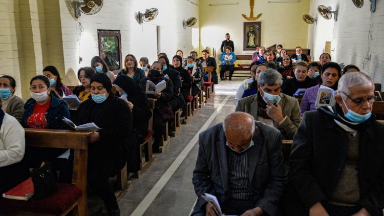 Iraqi Christans attend a prayer service at the Syriac Catholic Church in the town of Qaraqosh in Niniveh province, Iraq
