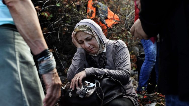 A file photo of a Syrian refugee arriving on the Greek island of Lesbos after crossing the Aegean Sea from Turkey