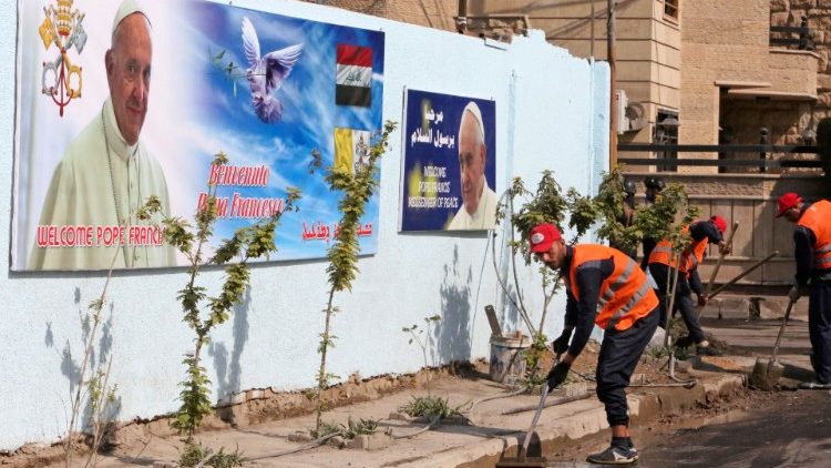 Workers pave the road in preparation for the Pope's visit to Iraq scheduled from 5 - 8 March