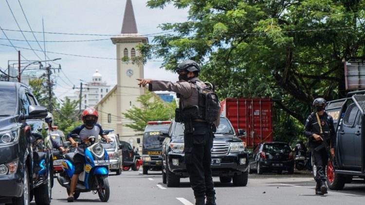 Indonesian police in Makassar after a suicide bombing at a Cathedral