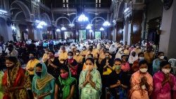 Indian Christians at prayer in a church. 