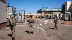 Security forces patrol a street  amid protests in South Africa