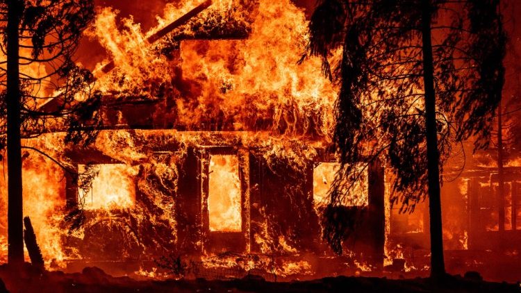 Flames tear through a home in California on 25 July 2021