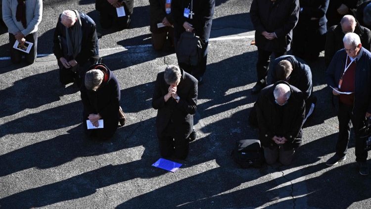 French bishops kneel as a sign of penance during a ceremony in Lourdes for abuse victims