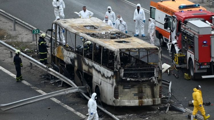 Officials at work at the site of a bus accident which killed 46 people