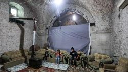 Children seek shelter in an abandoned church in al-Yaqubiya town in Syria's Idlib province. 