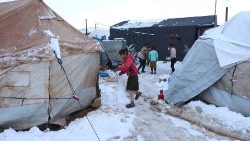 Children in the snow at a camp for internally displaced Syrians near Afrin city.