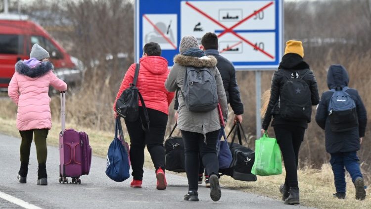 Ukrainian refugees cross the border in Barabas, Hungary