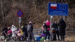 Refugees from Ukraine are seen as they arrive at the Polish-Slovakian border crossing in Kroscienko, Poland