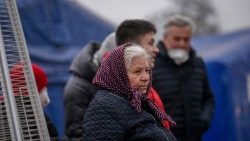 Ukrainian evacuees crossing the border into Romania