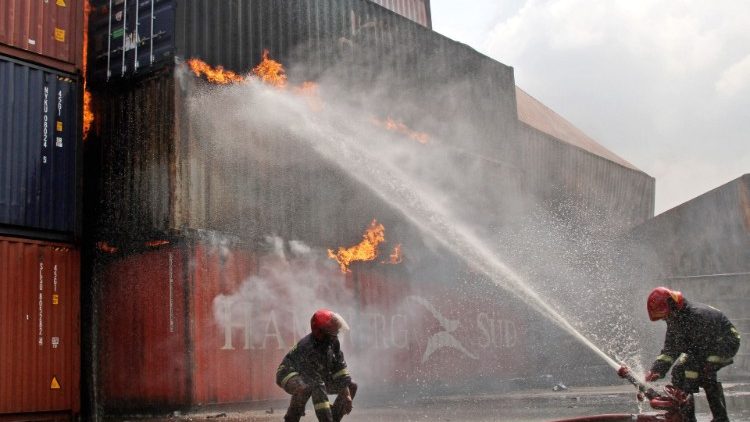 Firefighters try to extinguish the fire that broke out at a shipping container storage facility in Bangladesh