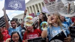 Pro-life activists celebrate outside the Supreme Court in the wake of the decision overturning Roe v Wade