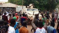 (File photo) Protesters gather around an army vehicle as they demonstrate in Ouagadougou, Burkina Faso