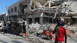 A local resident looks at the damage from Saturday's terrorist attack in Mogadishu