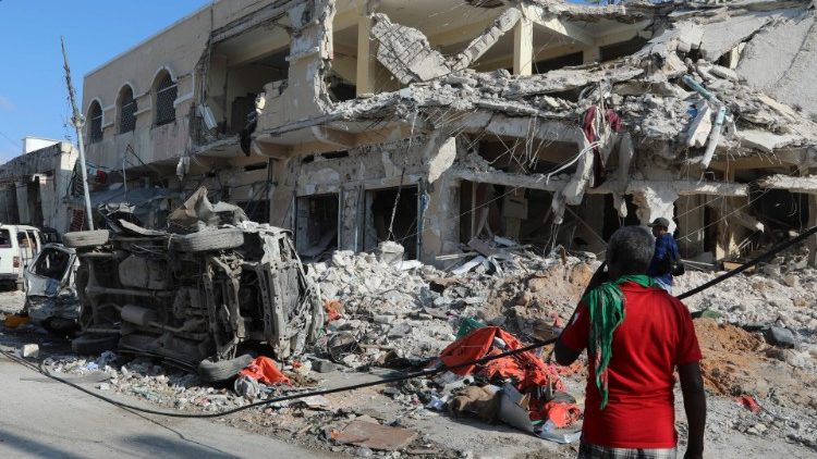 A local resident looks at the damage from Saturday's terrorist attack in Mogadishu