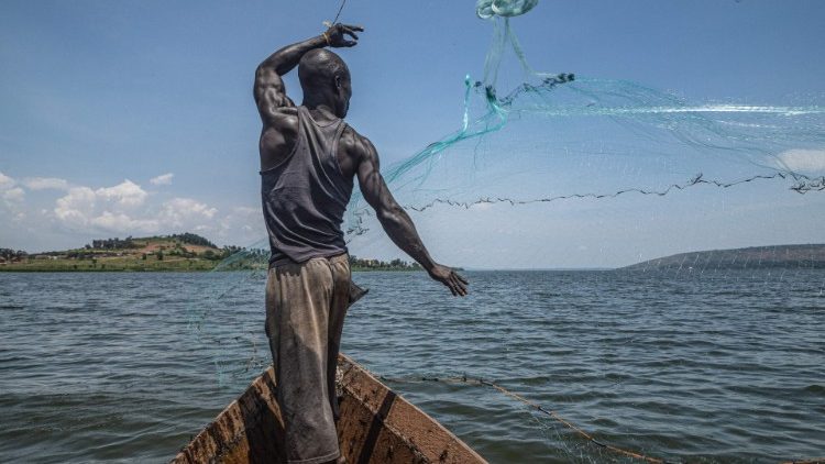 A fisherman casts his net on River Nile in southern Uganda, increasingly impacted by industrial pollution caused by government regulations allowing factories within 100 meters of the river bank