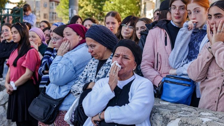 Mourners at the funeral of the young boy killed in the attack at a Jerusalem bus stop