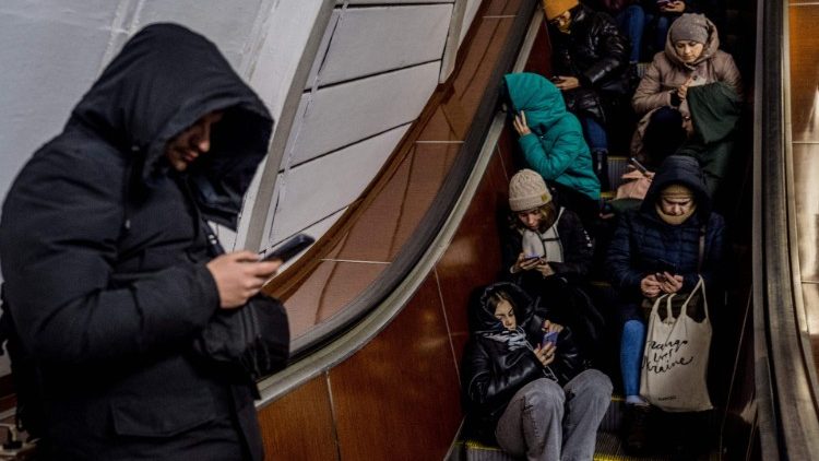 Residents of Kyiv take shelter in a metro station during an air strike alarm