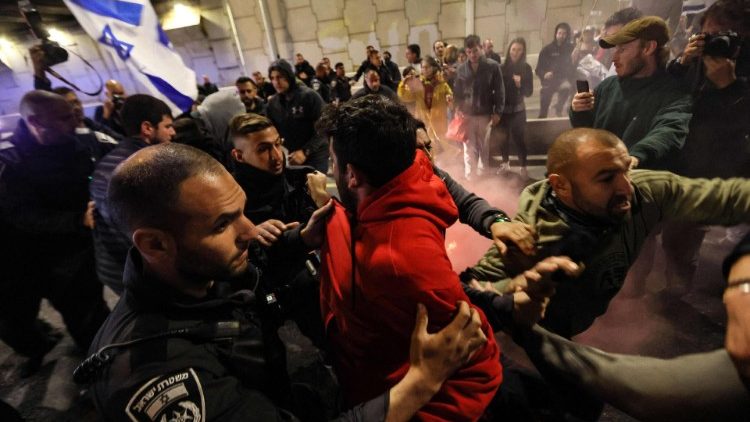 Protesters scuffle with security forces in Tel Aviv during a rally against the government's controversial judicial overhaul bill
