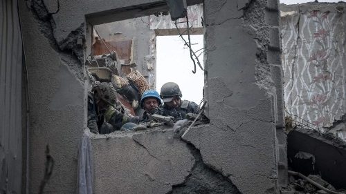 Rescuers search for survivors in a partially destroyed residential building, after a shelling in Sloviansk, on April 14, 2023
